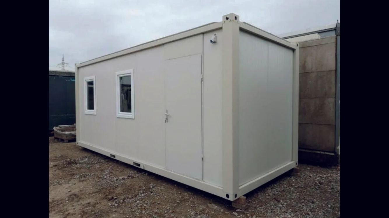 P2260 M flatpack container — single-unit exterior view with insulated panel walls, twin windows and centre door.